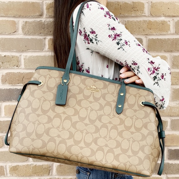 Coach Handbags - Gaby’sBags👜💕Coach drawstring totekhaki signature